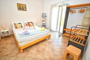 Postel nebo postele na pokoji v ubytování Adiomar cottage