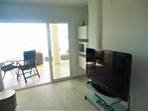 A television and/or entertainment centre at Costa Azahar LEK