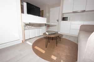 A kitchen or kitchenette at APARTAMENTOS CUME DO PINDO
