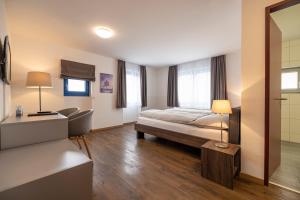 Postel nebo postele na pokoji v ubytování Hotel Restaurant Alte Brauerei