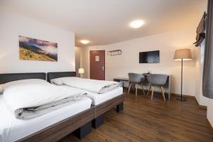 Postel nebo postele na pokoji v ubytování Hotel Restaurant Alte Brauerei