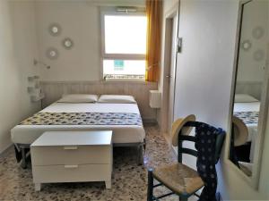 Postel nebo postele na pokoji v ubytování A Polignano Rooms