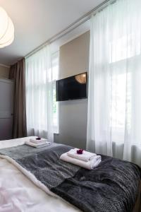 Postel nebo postele na pokoji v ubytování Hotel Marino