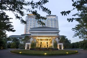 a hotel with a building in the background at Hotel Santika Premiere Slipi Jakarta in Jakarta