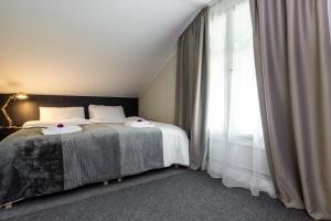 Postel nebo postele na pokoji v ubytování Hotel Marino