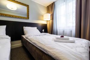 Postel nebo postele na pokoji v ubytování Hotel Marino