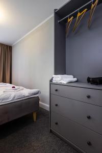 Postel nebo postele na pokoji v ubytování Hotel Marino