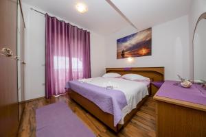 Postel nebo postele na pokoji v ubytování Apartments Šćerbe 3103