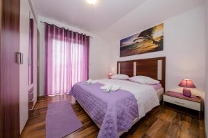 Postel nebo postele na pokoji v ubytování Apartments Šćerbe 3103