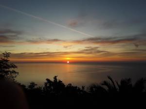 a sunset over a body of water at loft sul mare Sirolo in Sirolo