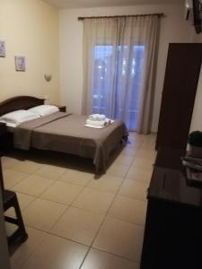 Posteľ alebo postele v izbe v ubytovaní Denis Studios and Apartments
