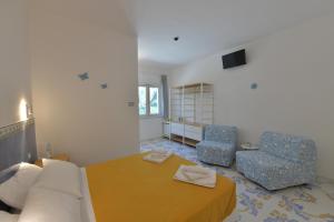 Postel nebo postele na pokoji v ubytování Acquadamare B&B