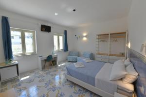 Postel nebo postele na pokoji v ubytování Acquadamare B&B