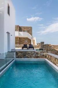 a swimming pool in the middle of a house at DeKo Villa Mykonos in Ano Mera