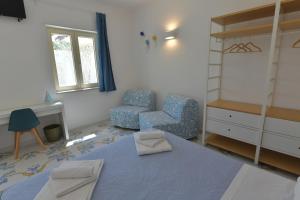 Postel nebo postele na pokoji v ubytování Acquadamare B&B