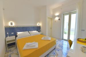 Postel nebo postele na pokoji v ubytování Acquadamare B&B