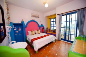 Postel nebo postele na pokoji v ubytování Captain Homestay