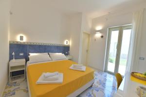 Postel nebo postele na pokoji v ubytování Acquadamare B&B
