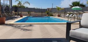 The swimming pool at or close to VILLA MARIANNA CON PISCINA PRIVATA ampi spazi esterni e WIFI FREE