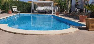 The swimming pool at or close to VILLA MARIANNA CON PISCINA PRIVATA ampi spazi esterni e WIFI FREE