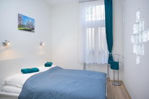 Posteľ alebo postele v izbe v ubytovaní Forrás Apartman