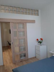 Posteľ alebo postele v izbe v ubytovaní Forrás Apartman