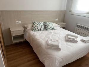 Ein Bett oder Betten in einem Zimmer der Unterkunft Apartamento entero en Sigüeiro a pie del camino inglés