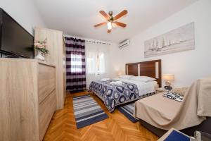 Postel nebo postele na pokoji v ubytování Apartments Šćerbe 3103 + 37 fotografií