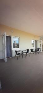 a room with chairs and a table in a building at Estate House in Zatoka