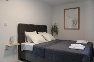 Posteľ alebo postele v izbe v ubytovaní Apartman Boki