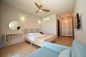 Giường trong phòng chung tại Limnos Otel