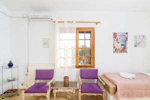 Postel nebo postele na pokoji v ubytování Romanza Villas