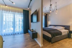 Łóżko lub łóżka w pokoju w obiekcie House Managers - Nadmotławie