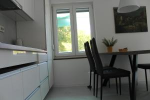 Kuchyňa alebo kuchynka v ubytovaní Apartman Boki