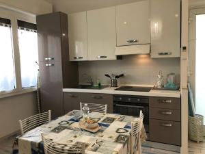 A kitchen or kitchenette at Appartamento ADRIANA