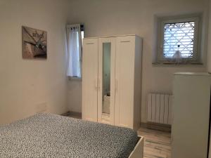 A bed or beds in a room at Appartamento ADRIANA
