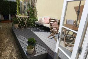 a door leading to a patio with a table and a chair at Grade II listed, town house in Monmouth