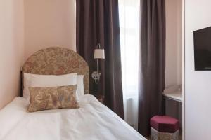 Postel nebo postele na pokoji v ubytování Hotel Ruth, WorldHotels Crafted