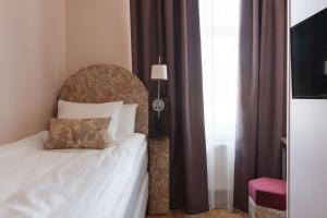 Postel nebo postele na pokoji v ubytování Hotel Ruth, WorldHotels Crafted