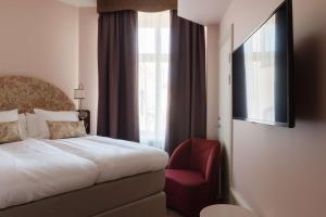 Postel nebo postele na pokoji v ubytování Hotel Ruth, WorldHotels Crafted
