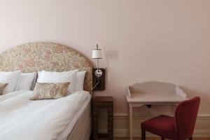 Postel nebo postele na pokoji v ubytování Hotel Ruth, WorldHotels Crafted