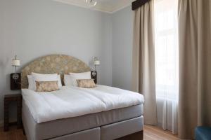 Postel nebo postele na pokoji v ubytování Hotel Ruth, WorldHotels Crafted