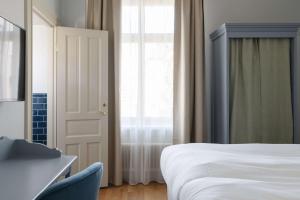 Postel nebo postele na pokoji v ubytování Hotel Ruth, WorldHotels Crafted