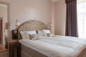 Postel nebo postele na pokoji v ubytování Hotel Ruth, WorldHotels Crafted