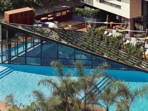 an overhead view of a building with a swimming pool at Sofitel Barcelona Skipper in Barcelona