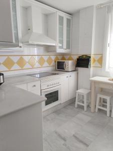 Kuchyňa alebo kuchynka v ubytovaní Apartamento Nao Victoria