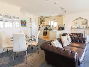 a living room with a couch and a table at Sea View apartment in Porthmadog
