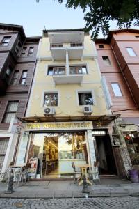 a store front of a building with a table outside at Vefa Hotel&Suites in Istanbul