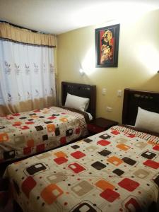 Postel nebo postele na pokoji v ubytování Hotel Navarra