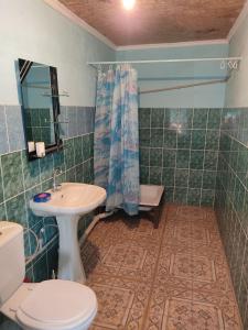 a bathroom with a toilet and a sink at Отдых в Капшагае! in Kapchagay